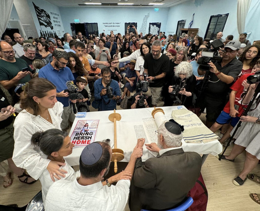 Their son captive in Gaza, parents dedicate a Torah scroll to 120 remaining hostages