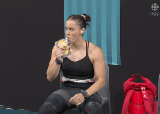 Canadian weightlifter Maude Charron drinking Canadian Maple Syrup before winning silver