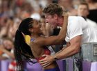 Tara celebrating her gold medal with her husband
